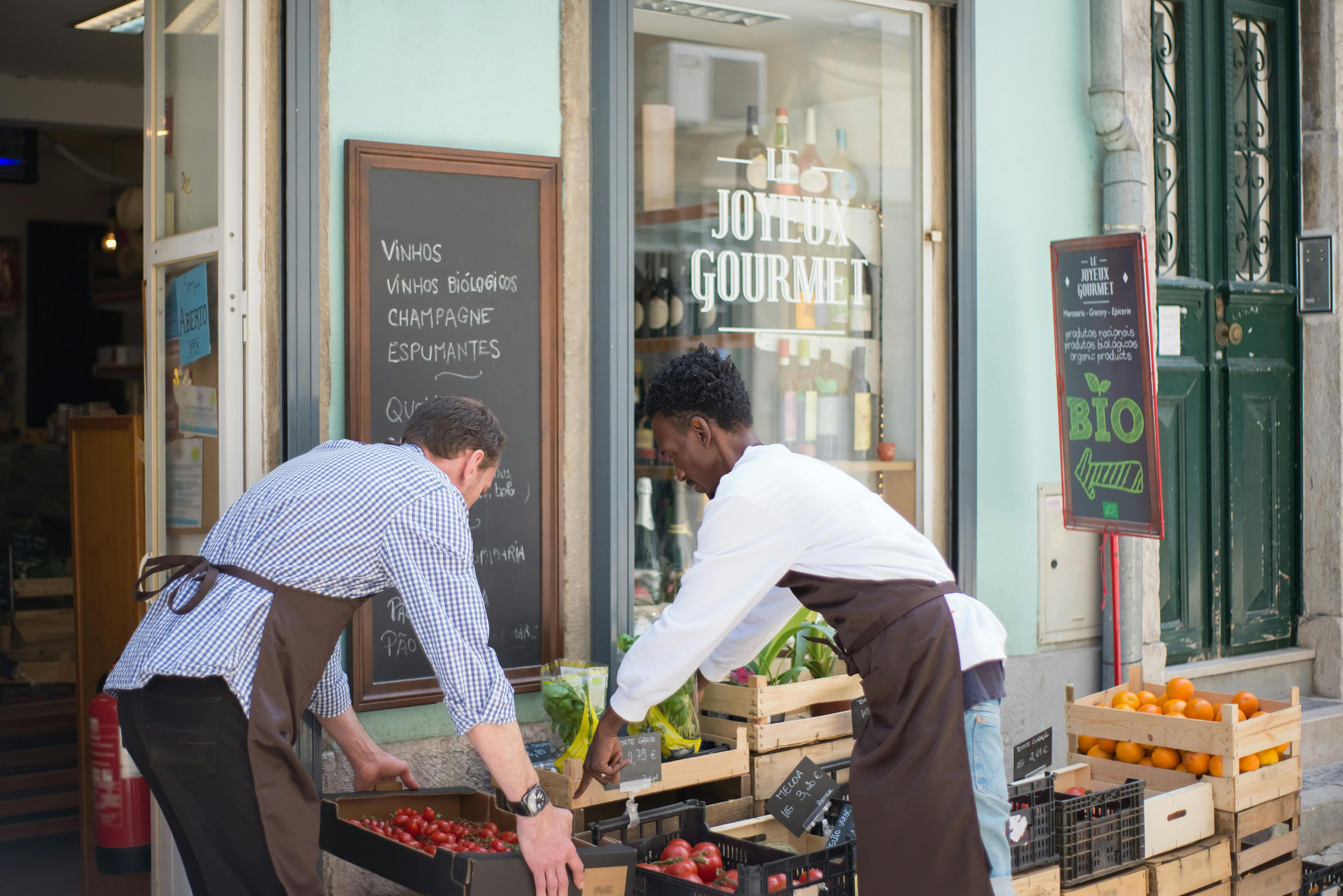 People working outside a Lisbon café.